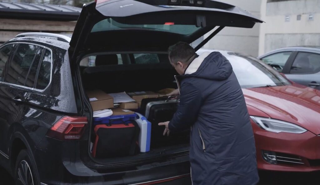 Stago's field service engineer picking up his tools and supplies from his car stock that he can sync in his resco mobile inspection app and this automatically updates in the erp system